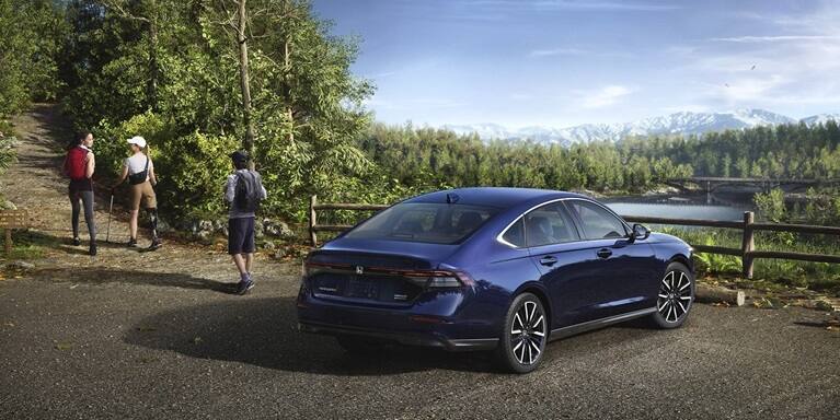 2026 Honda Accord 3/4 rear view parked in a turnout for a trailhead.