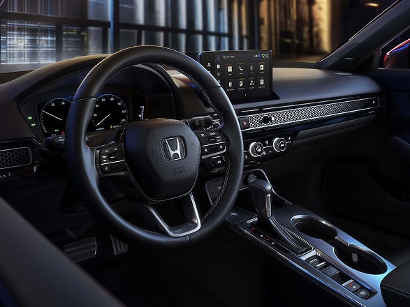 2026 Honda Civic Hatchback Sport Touring Hybrid interior dashboard, steering wheel, and digital infotainment screen (Compact Hatchback).